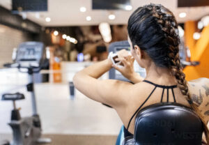 Asturias, Spain, woman usin her smartwatch in gym